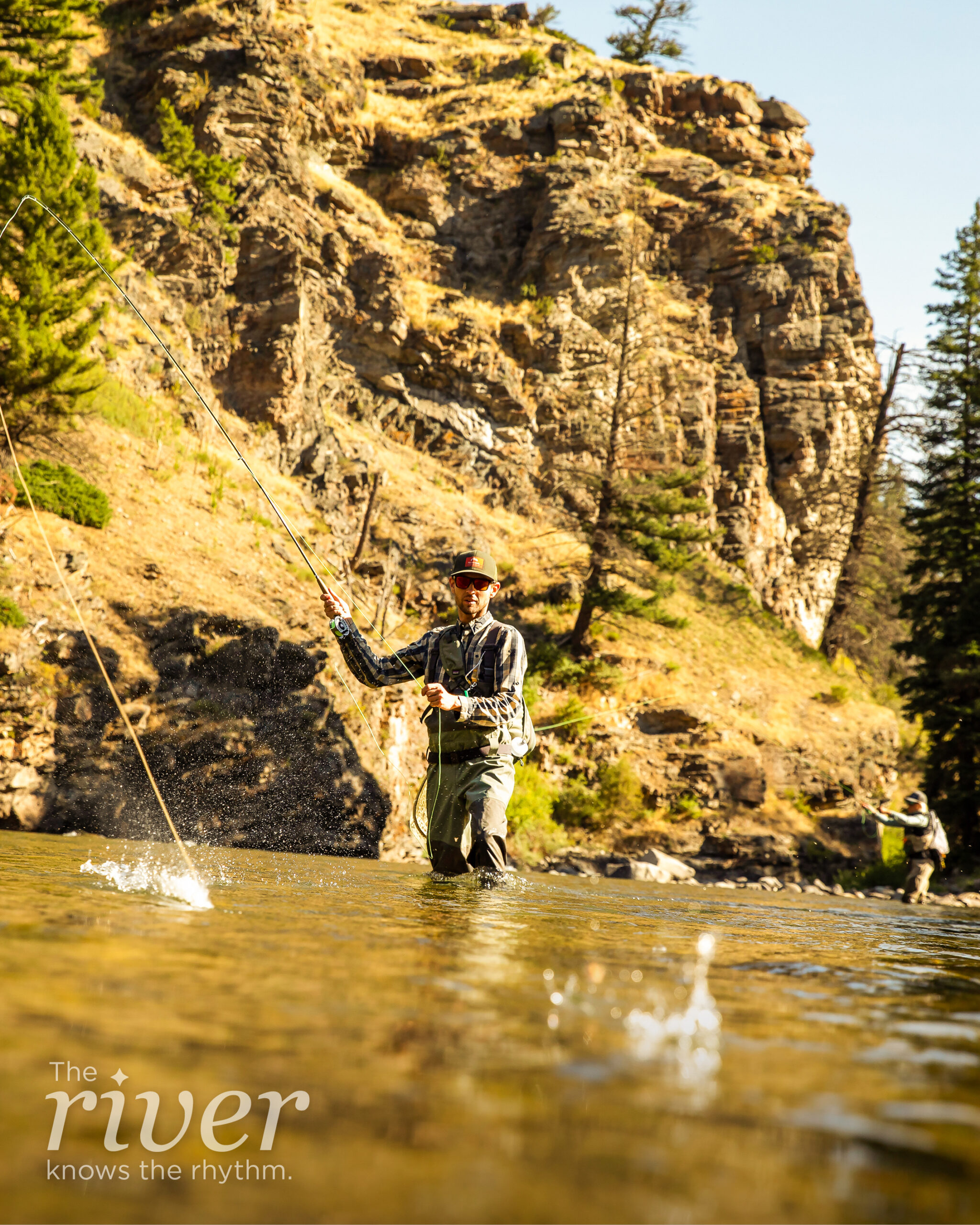 a man fishing in the river - "the river knows the rhythm" 