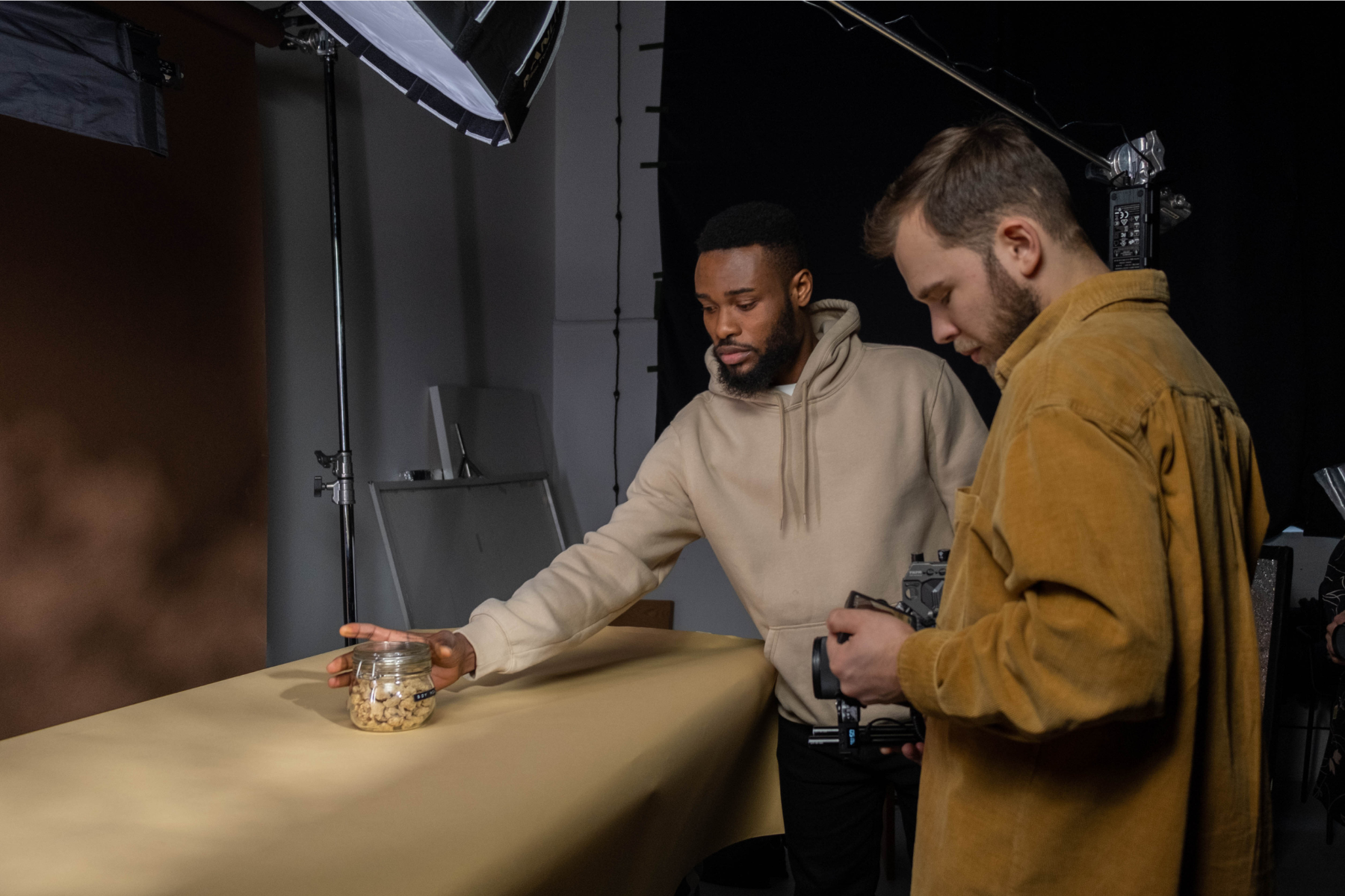 Photo of 2 small business owners setting up a simple Product Photography shoot.