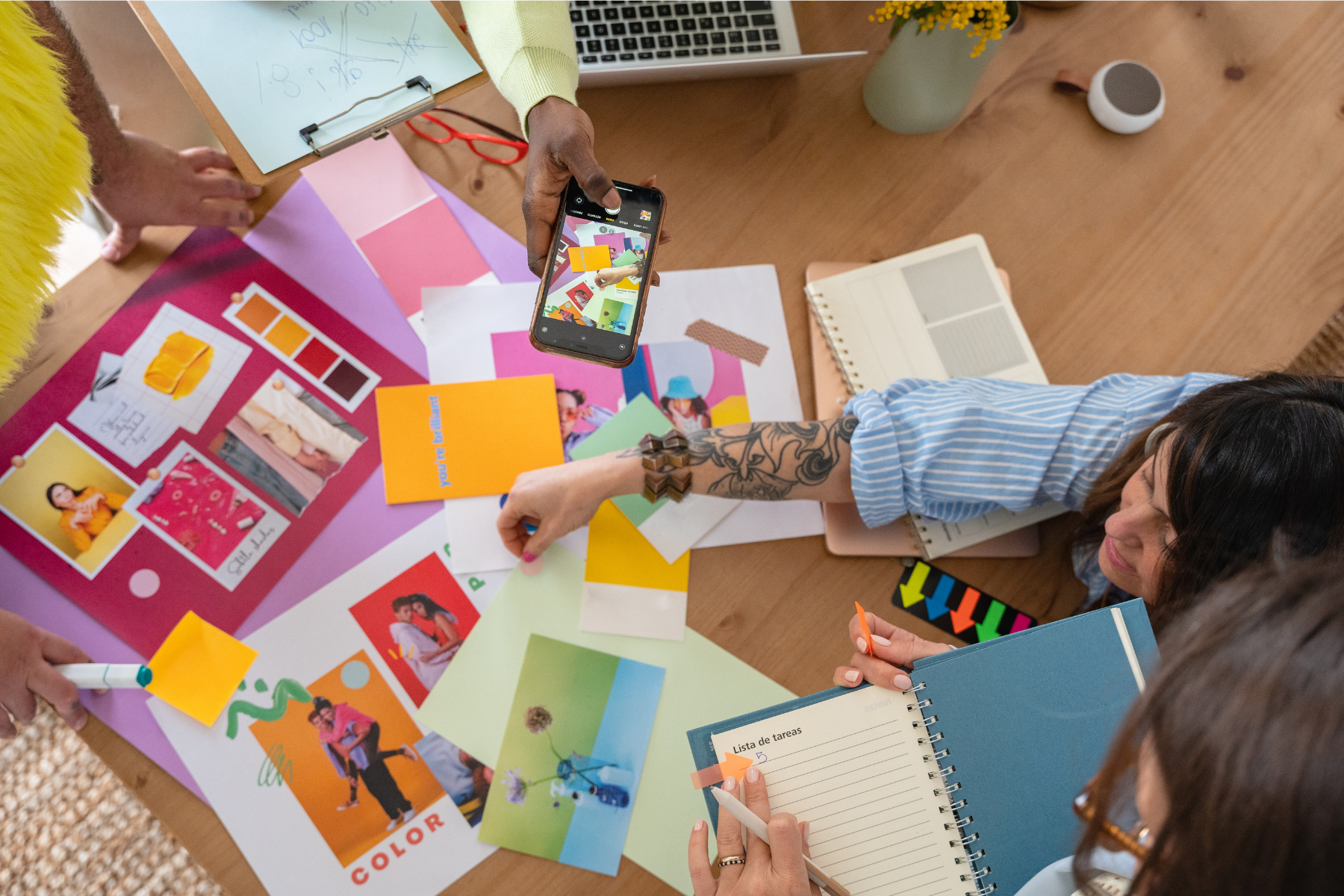 Overhead photo of a table spread wth branding elements including colors, photos, etc.
