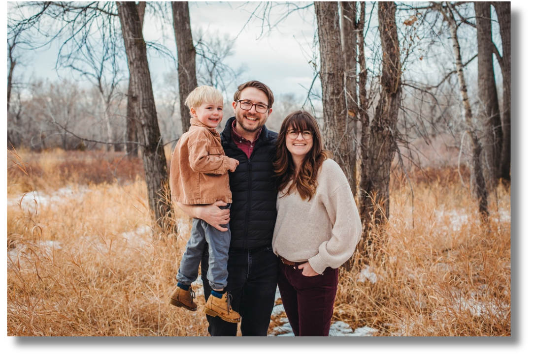 Team member with family in an autumn forest