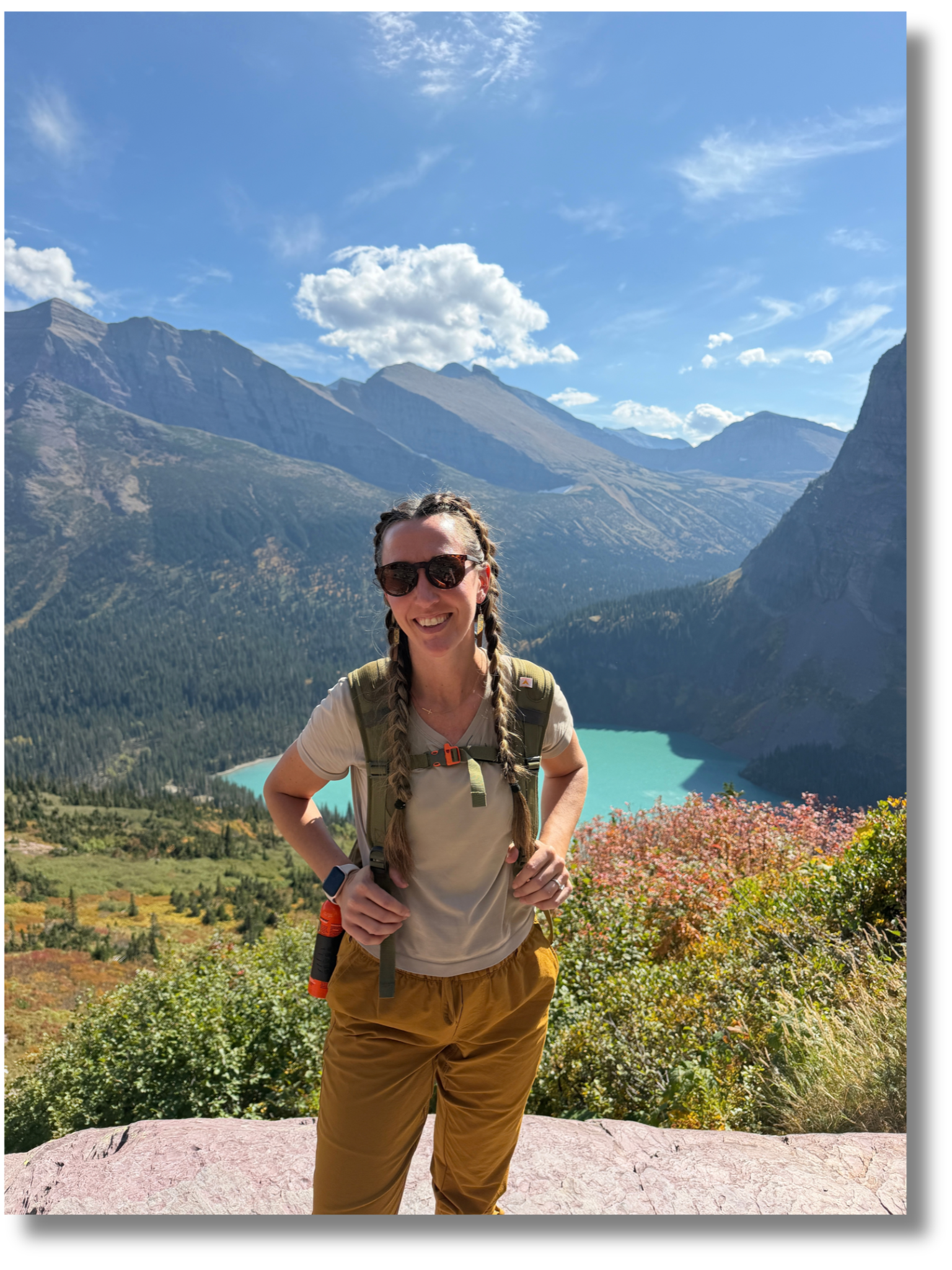 Team member hiking above a mountain lake